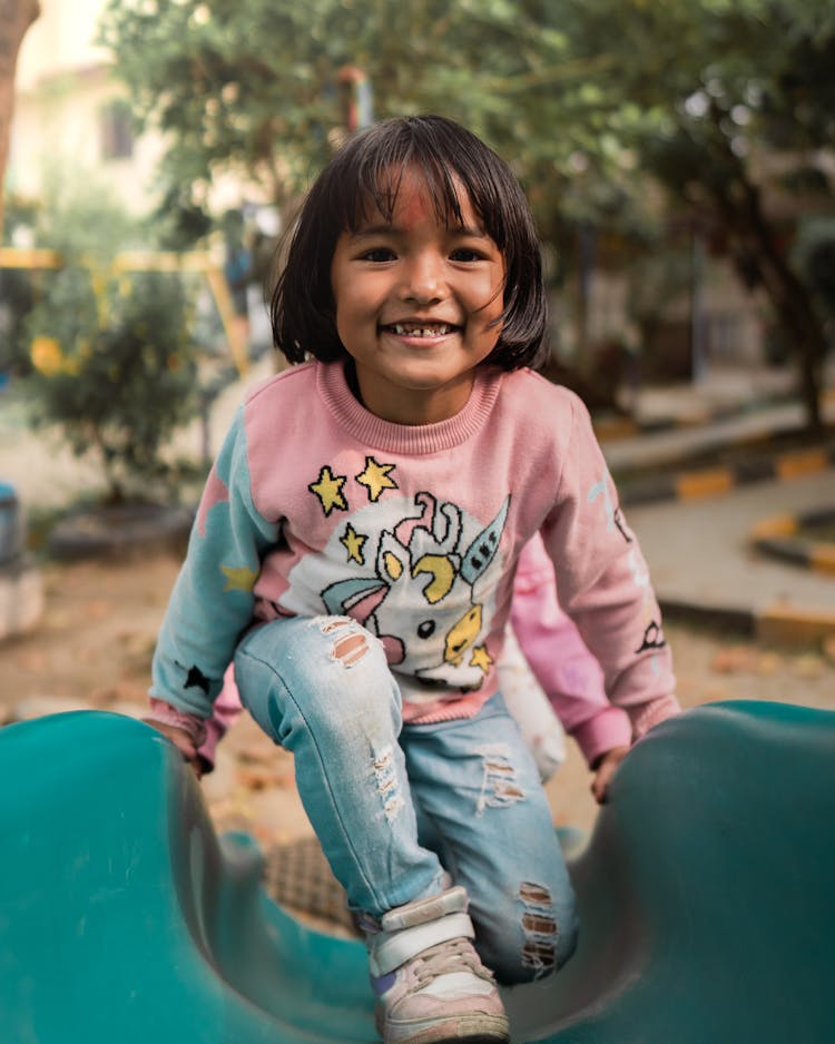 Little Girl In The Playground 