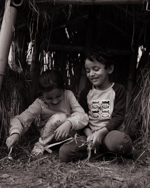 Free Grayscale Photo of Kids Playing on the Grass Stock Photo