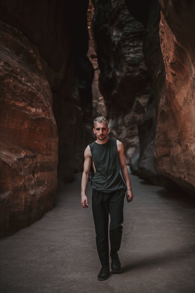 Man Walking Among Rocks