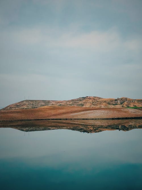 Calm Lake under a Cloudy Sky