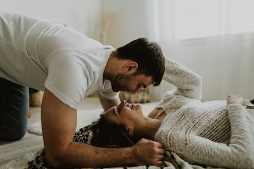 Young Couple Lying on Bed 