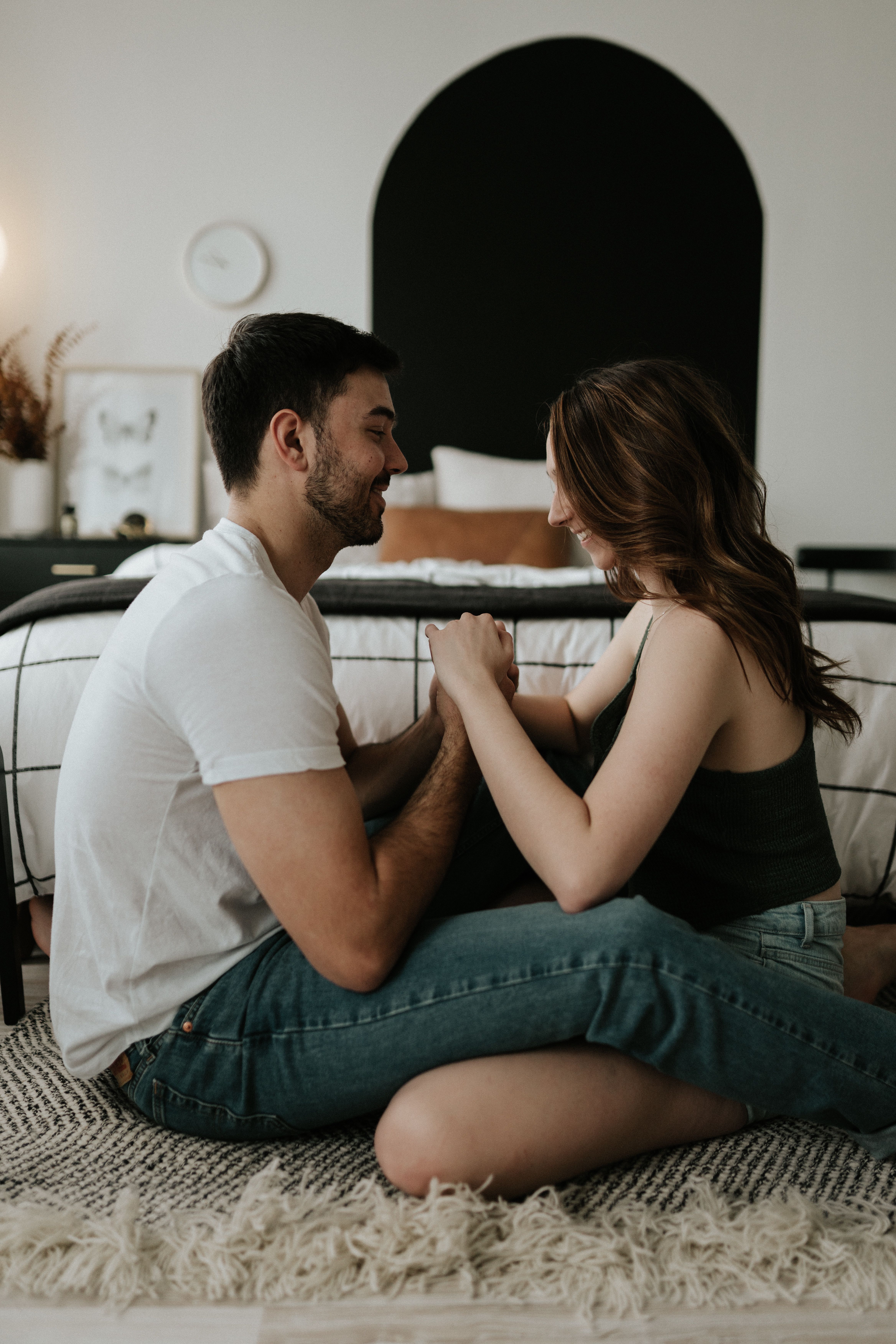 A Couple Sitting on the Floor and Holding Hands · Free Stock Photo