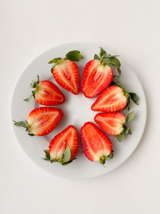 Appetizing Strawberry Halves Arranged in Circle on Plate