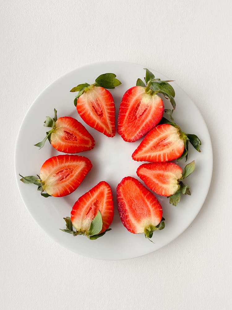 Appetizing Strawberry Halves Arranged In Circle On Plate