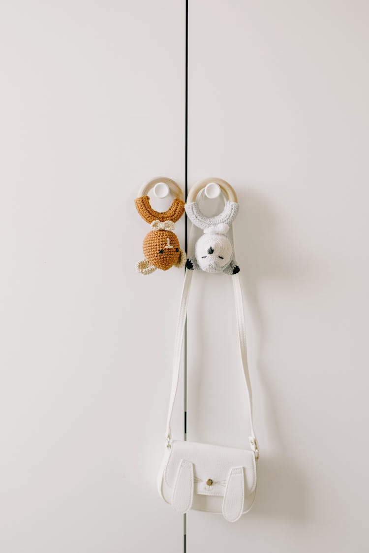 A Toys And Bag Hanging On The Cabinet