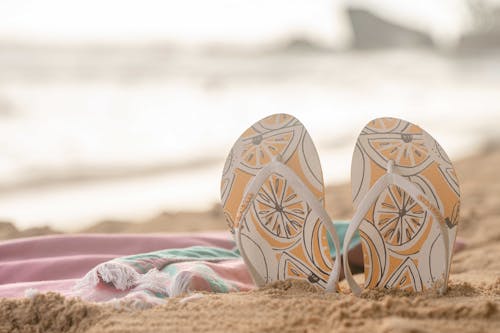 Free Flip Flops on Sand Stock Photo