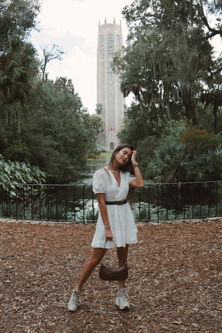 Woman Posing In Empty Park Alley