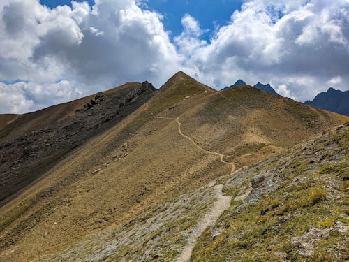 Brown Mountains under the Cloudy Sky