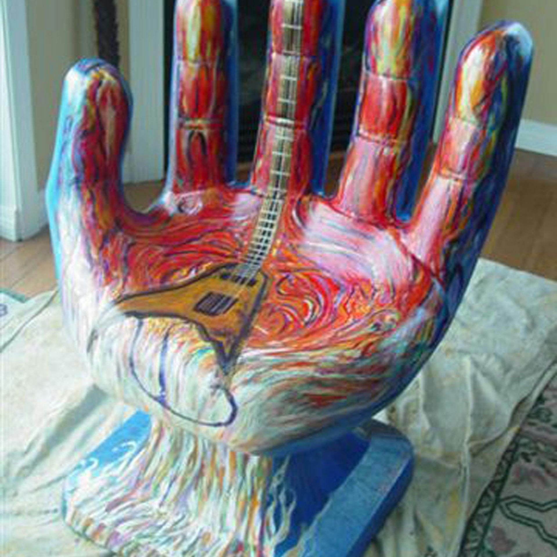 Free stock photo of Artist Peter Daniels., Hand sculpture with guitar.