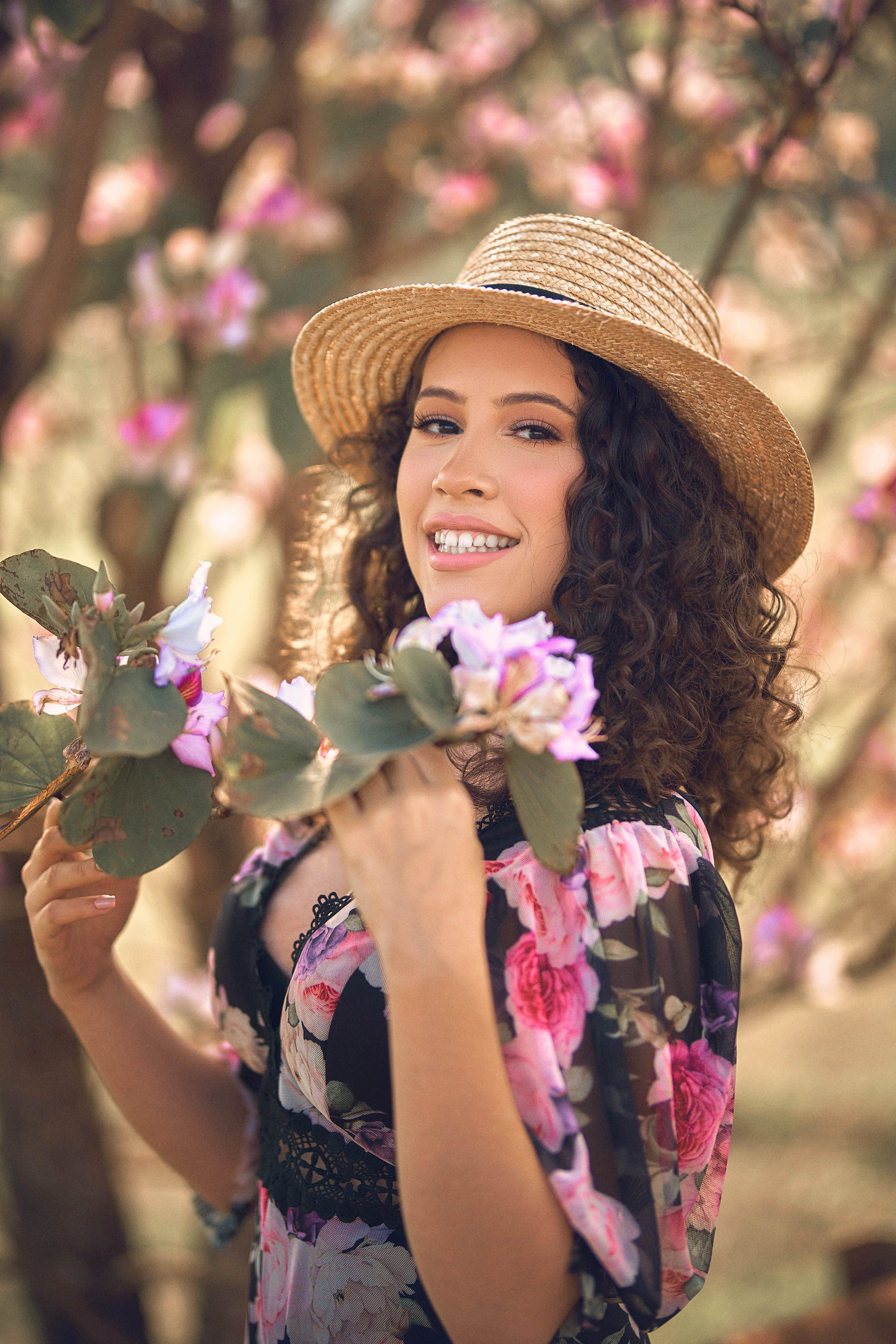 A Woman in Black and Pink Floral Dress · Free Stock Photo