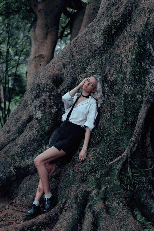 Free Woman Leaning on Big Tree Stock Photo