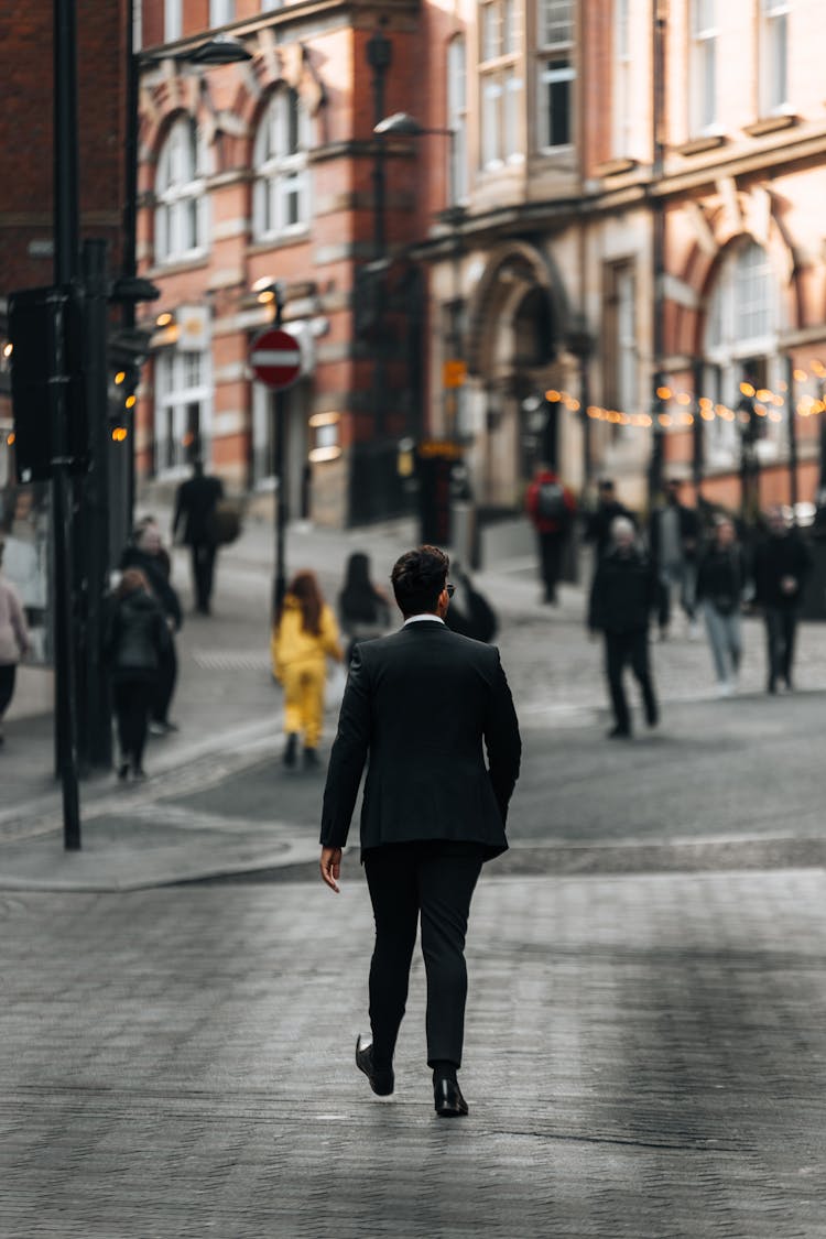 Man In Suit Walking In City