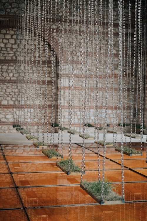 Contemporary Art Installation with Swings in an Old Building Interior