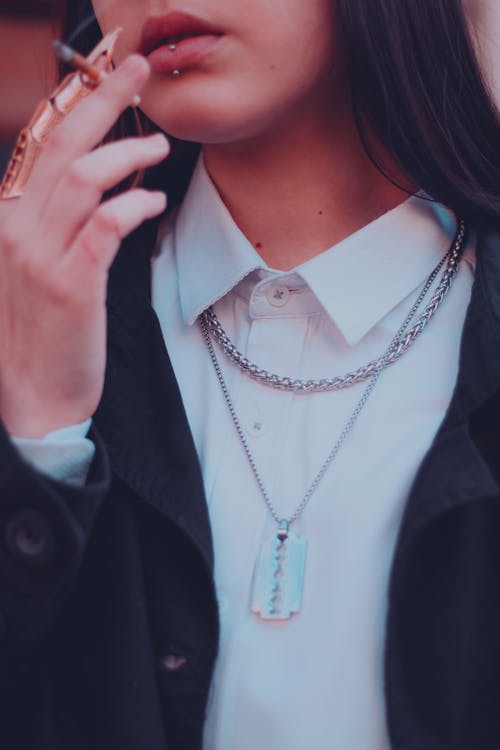 Smoking Young Woman with Necklace