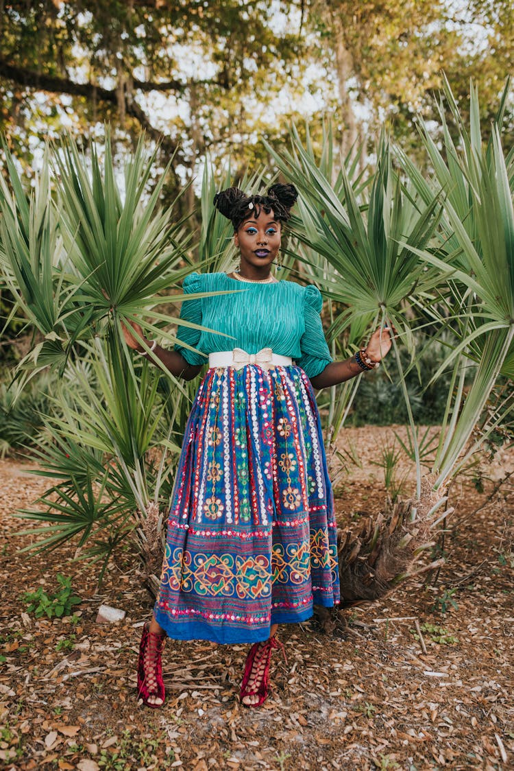 Woman Posing Among Plants