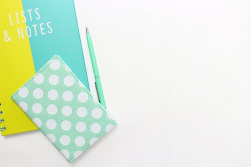 Free White and Teal Notebook Stock Photo