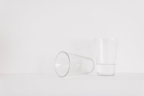 Free Two Clear Drinking Glasses on Table Stock Photo
