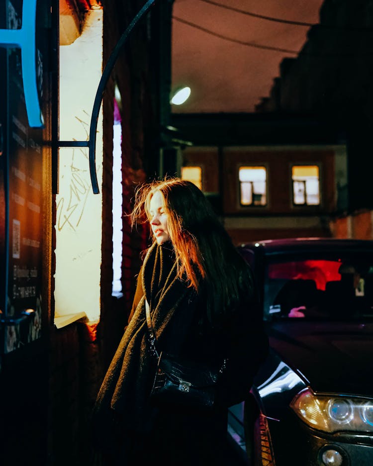 Woman On Coat Next To Car