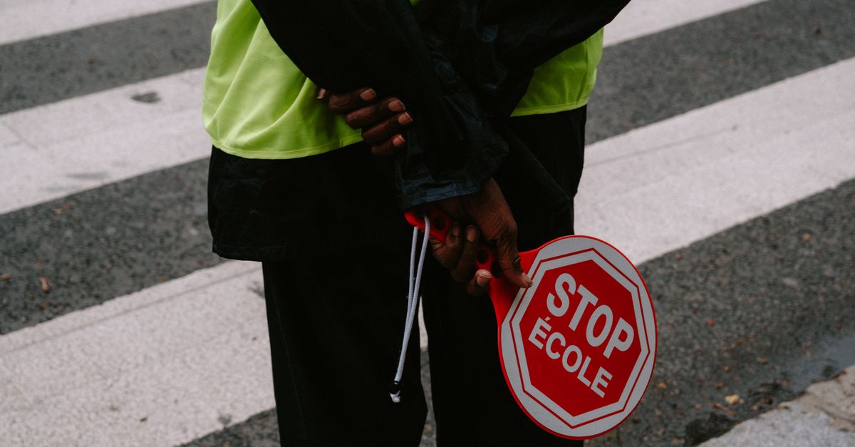 person holding a stop sign in a meeting room