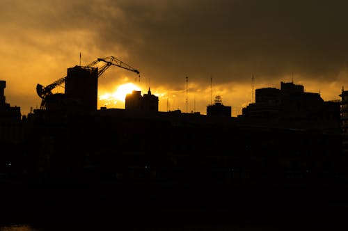 Silhouette of Buildings During Sunset