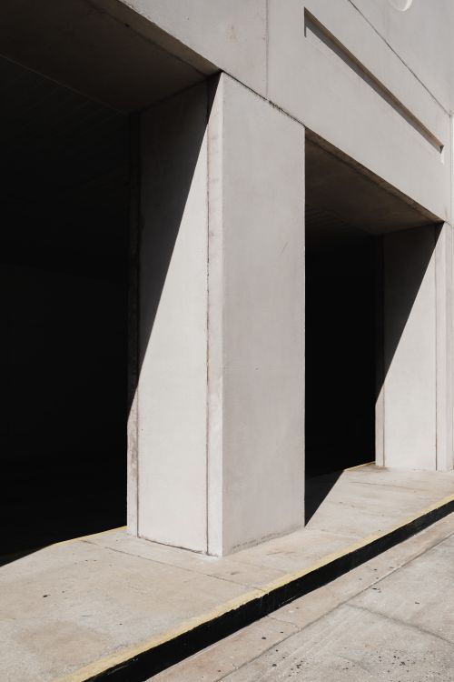 Free Explore the stark lines and shadows of a modern concrete structure in urban Orlando. Stock Photo