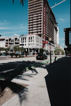 A bustling street scene in downtown Orlando showcasing construction and urban life.