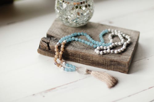 Blue Beads on a Wood Plank 