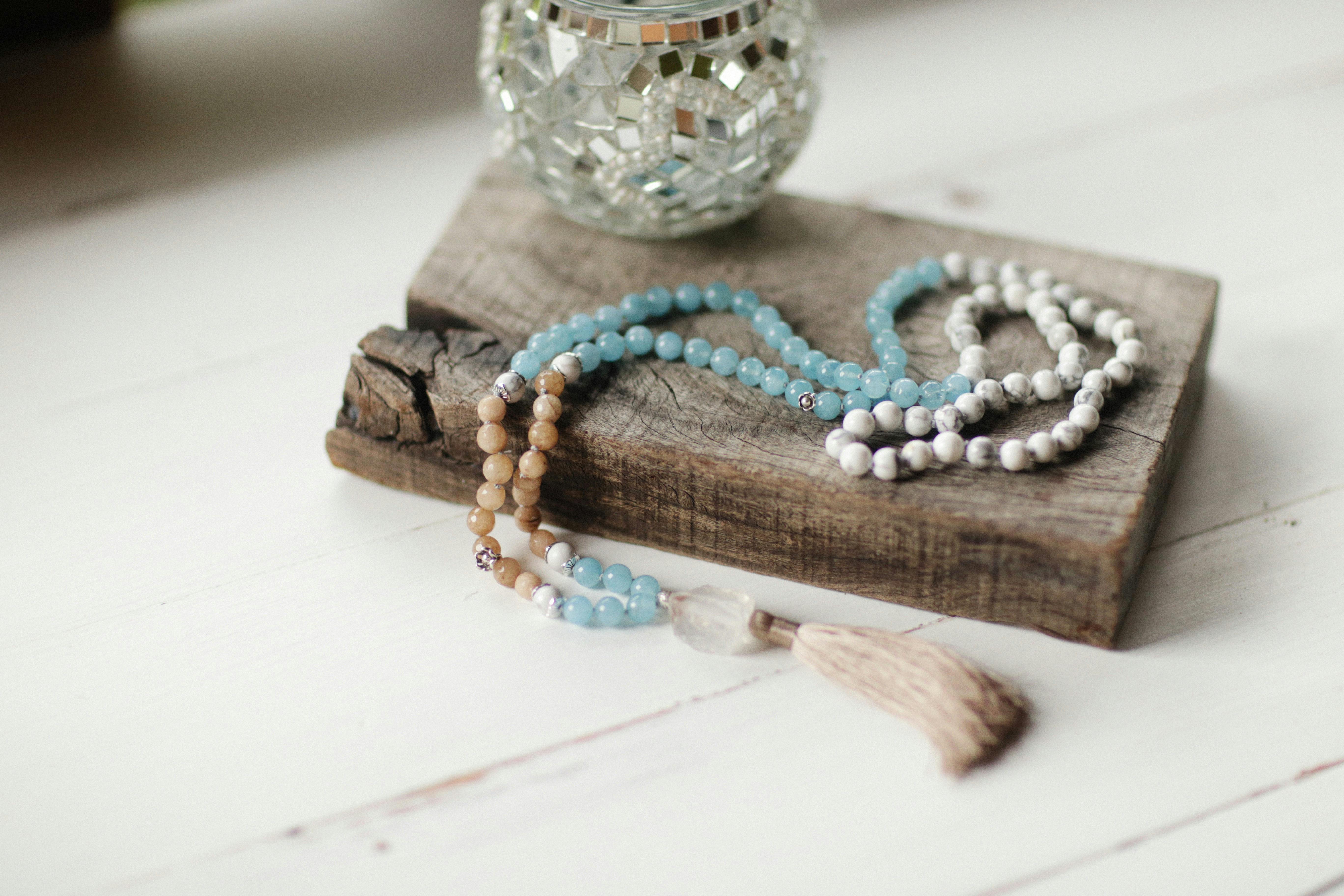 Woman Holding Her Necklace · Free Stock Photo