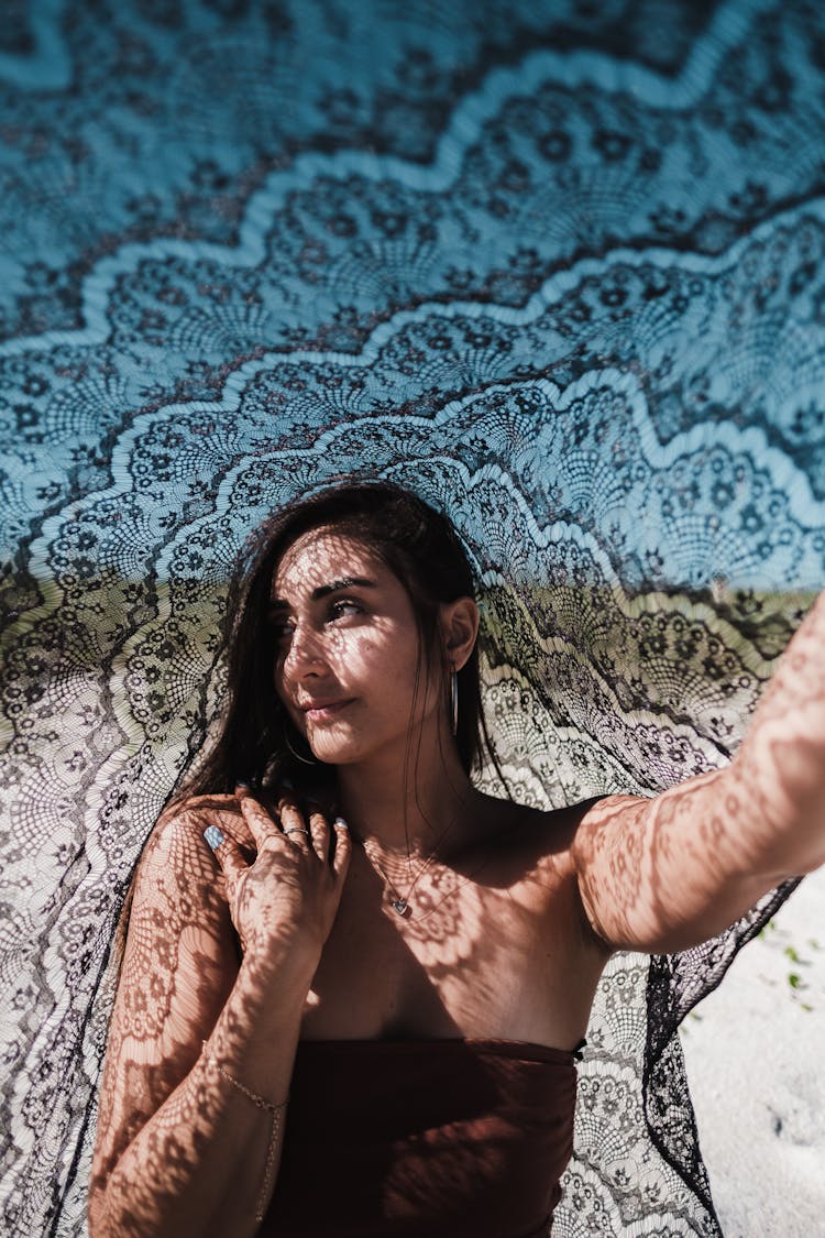 Woman Posing With Fabric At Beach