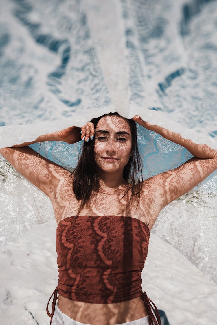 Woman Smiling With Fabric Over Head