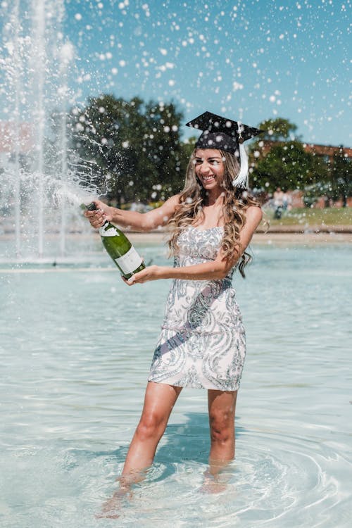 Woman with Champagne in Fountain