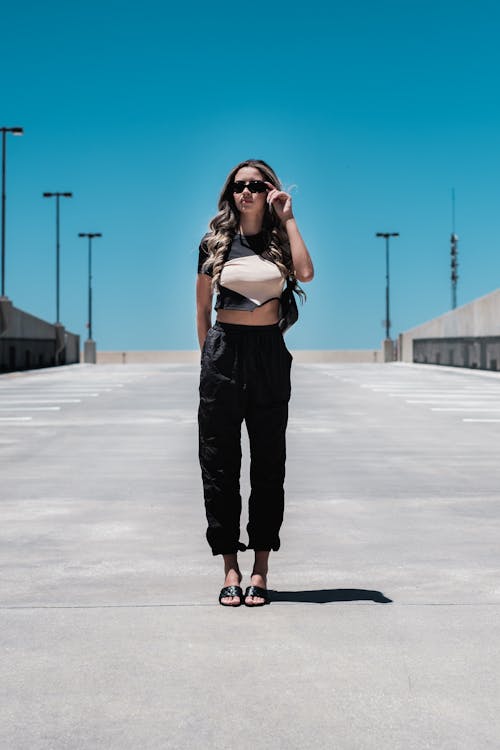 Stylish Woman standing in Pavement 