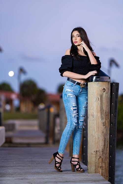 Woman in Jeans Posing on Pier
