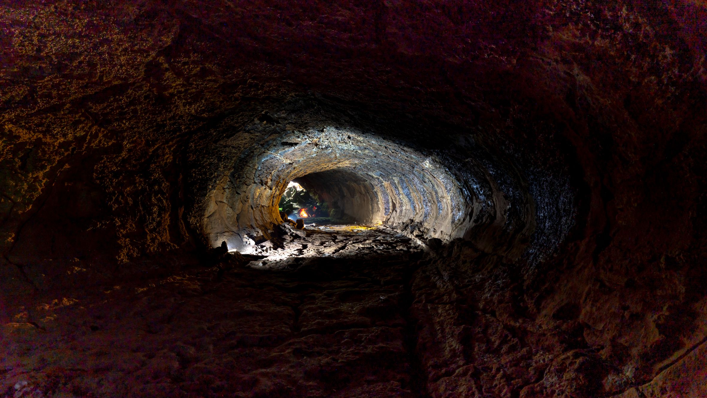 Explore the fascinating textures and formations inside a natural lava tube cave.