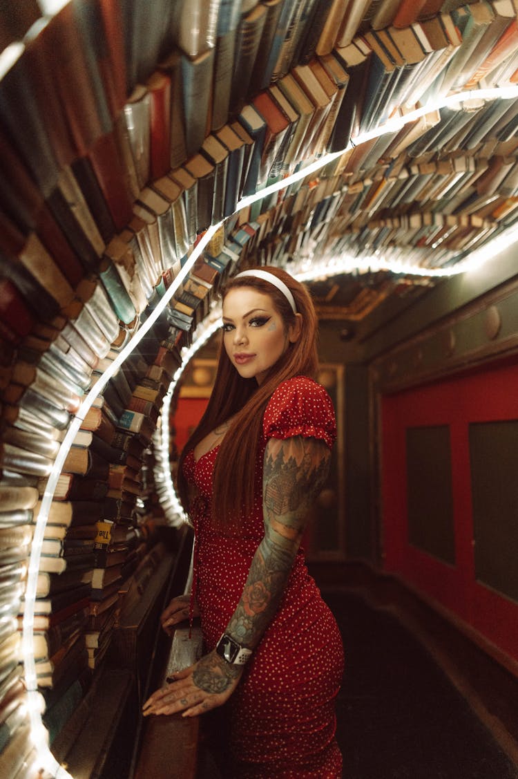 Woman With Tattoo Among Books