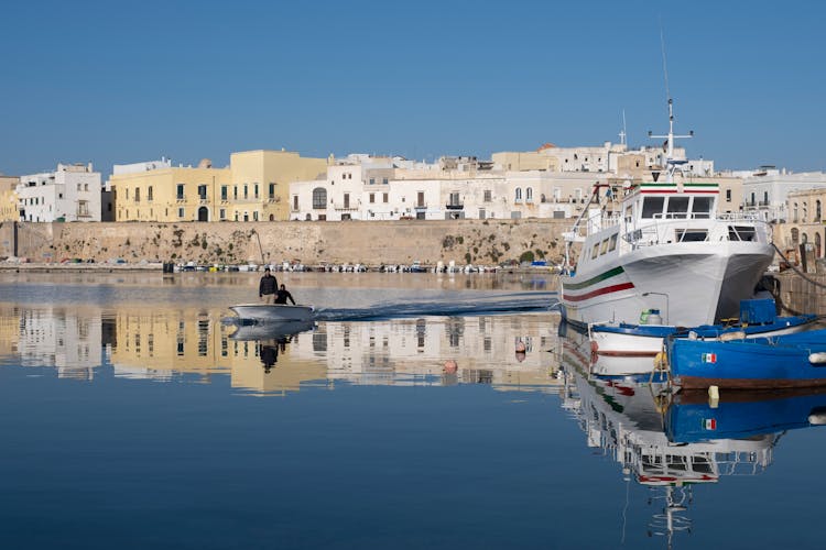 Men On Boat In Marina