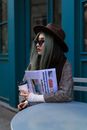 Woman in Brown and White Long Sleeve Shirt Reading Book