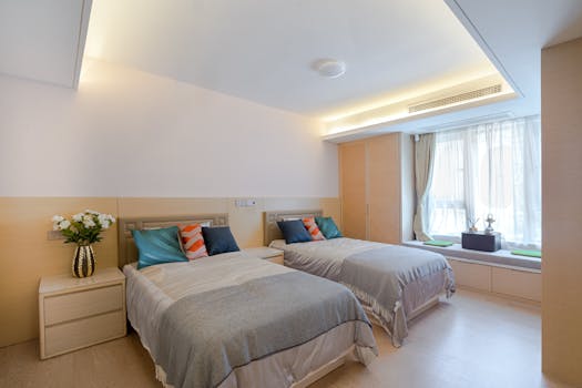 Modern and elegant twin bedroom with stylish interior decor and cozy atmosphere.