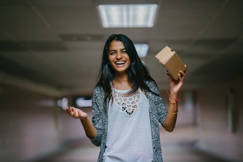 Free Woman Holding Brown Cardboard Box Stock Photo