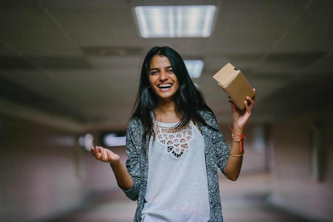 Woman Holding Brown Cardboard Box