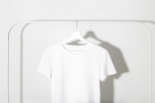 White T-Shirt hanging on a Rack 