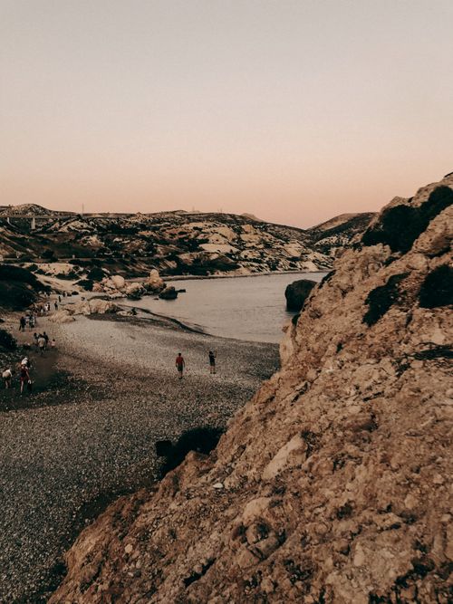 Free Explore the stunning pebble beach in Paphos, Cyprus, captured beautifully at sunset. Stock Photo