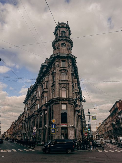 Free Iconic 19th-century Russian architecture in St. Petersburg with a dramatic cloudy sky backdrop. Stock Photo