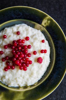 Red Cherry on White Soup Dish in Brown Plate