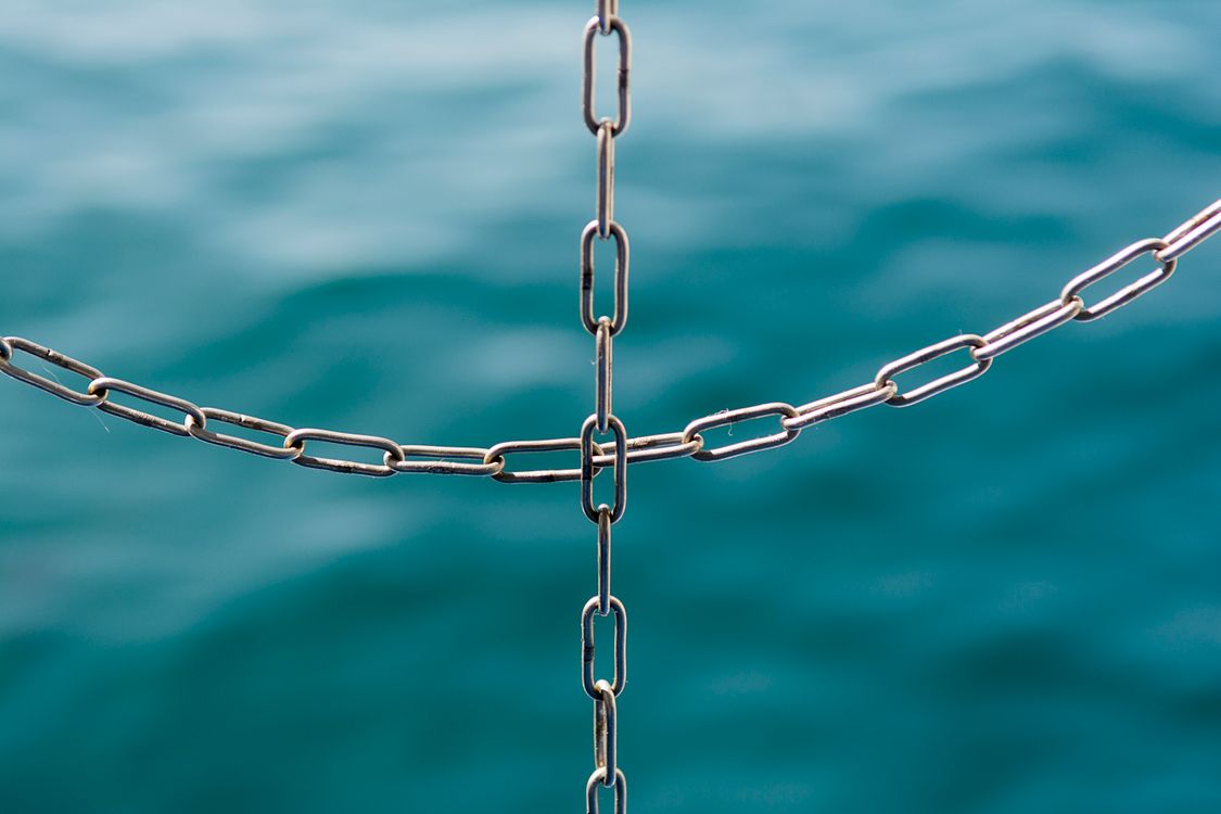 Close Up of Symbolic Connected Chains · Free Stock Photo