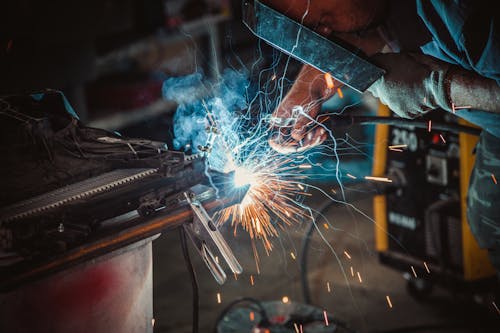 Close-up Photo of Welder doing a Labor 