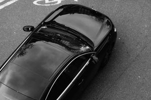 Dark sedan photographed from directly above — photo by Mathias Reding on Pexels