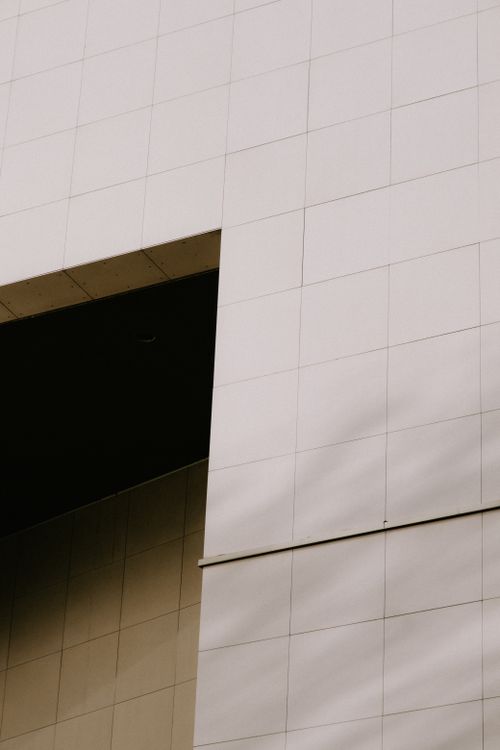 Free Close-up view of a modern high-rise building facade with geometric design. Stock Photo