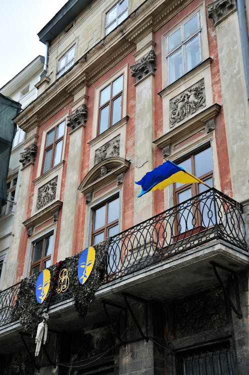 Ukraine Flag Swaying on the Balcony of an Apartment Building
