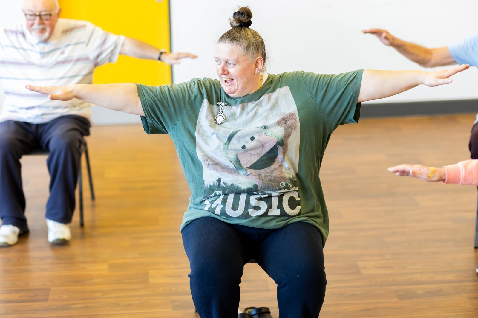 Senior citizens exercising together in a low-impact fitness class